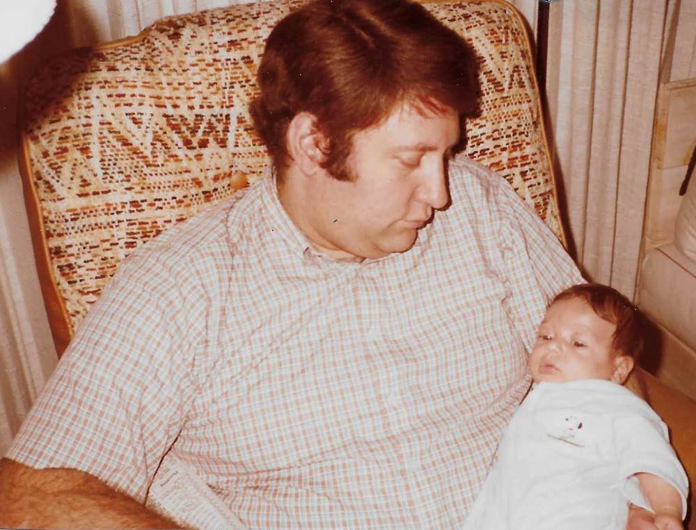 Mike Schuminsky holding baby Jay