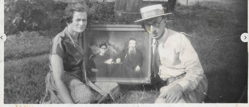 Sam and Anna Gedanke holding a portrait of Sam's parents, 1939